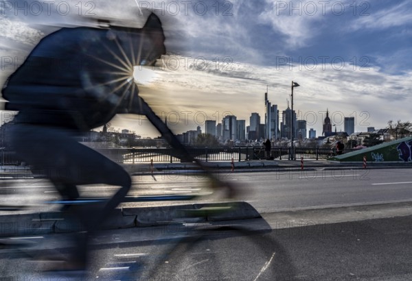 Skyline of Frankfurt am Main, skyscrapers, cyclists on the Flößerbrücke, Hesse, Germany, Europe