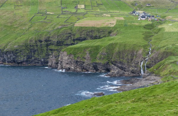 Coastal view with waterfall and Vidareidi village, Vidoy Island, Viðareiði, Viðoy Island, Faroe