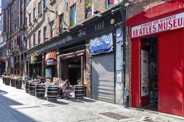 Urban scene with the Beatles Museum and outdoor cafés, Liverpool