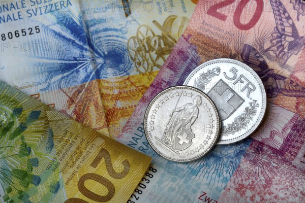 Swiss coins on banknotes, Switzerland, Europe