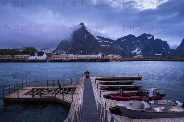 View of Sakrisoy with its typical yellow or ochre-coloured wooden houses on wooden stilts (rorbuer)