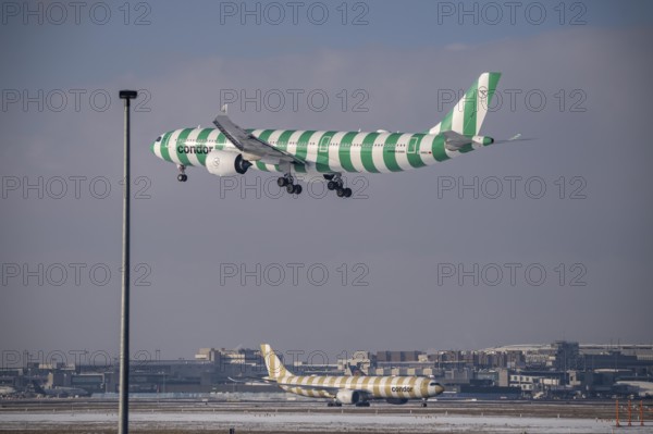 Condor Airbus A330-900 approaching Frankfurt Airport FRA and on the taxiway, Fraport, in winter,