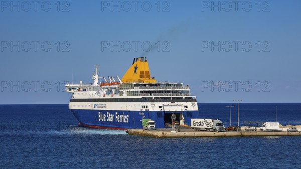 Large ferry of Blue Star Ferries at the harbour, ready for departure on clear and calm sea,