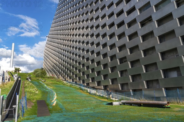 CopenHill, waste incineration plant and artificial ski slope, skiing with a view of the ski lift,