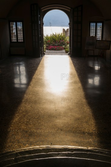 View from the inside of a city villa, light, sun, sunbeam, backlight, dramatic, architecture,