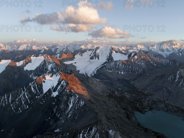 Evening mood, mountain panorama, aerial view, 4000 metre peak with glacier, mountain pass and