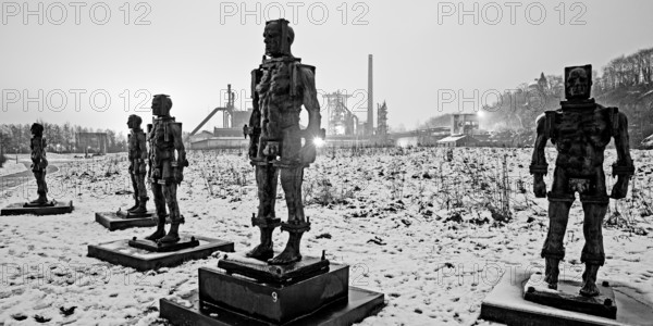People made of iron, multi-part iron sculpture by Zbigniew Fraczkiewicz in front of the