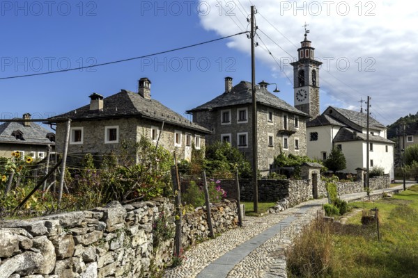 View of the village, typical Ticino stone houses in the mountain village of Rasa, Centovalli,