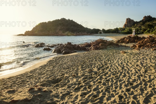 Lonely picturesque beach and red rocks, Spiaggia Su Sirboni, sunrise, near Tertenia, Province of