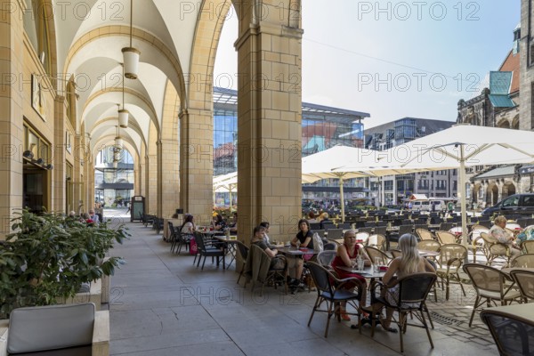 Street café in the Red Tower Gallery with seating on the market square in front of the New Town