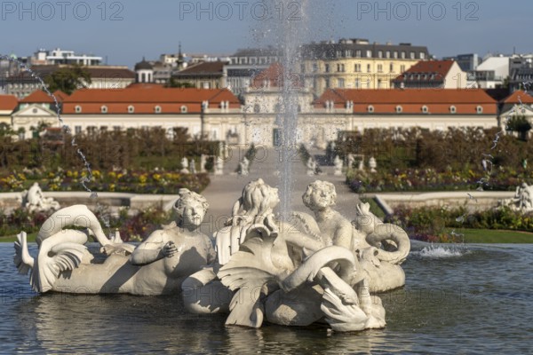 Fountain in the palace gardens and the Lower Belvedere in Vienna, Austria, Europe