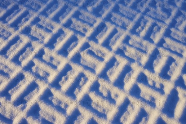 Geometric pattern in the snow in clear winter light, winter, Wasserkuppe, Gersfeld, Rhön, Hesse,