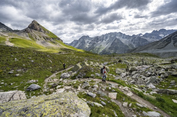 Mountaineer on a hiking trail, mountain landscape near Arolla, Valais, Western Alps Switzerland