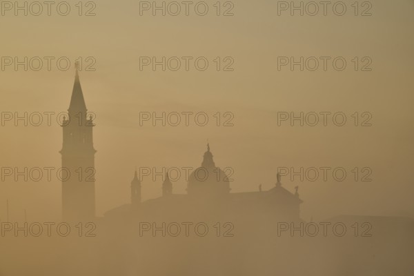 View from 'Colonna di San Marco e San Teodoro' on church 'Giorgio Maggiore' on a foggy morning at