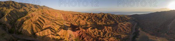 Aerial view, eroded mountain landscape, sandstone cliffs, canyon with red and orange rock