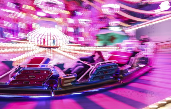 Visitors ride in a Musik Express ride, Berlin, 09.12.2022