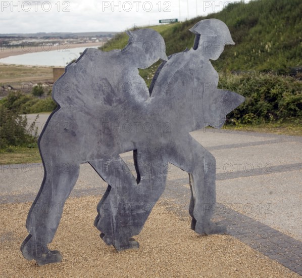 Figures of soldiers carrying ammunition, Newhaven Fort, East Sussex, England, United Kingdom,