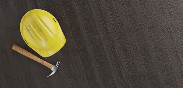 Overhead of yellow hard hat and hammer on a wood surface with room for text