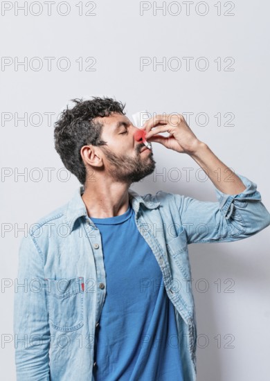 Person with nasal congestion, Person with irritated nose on isolated background, man with red nose