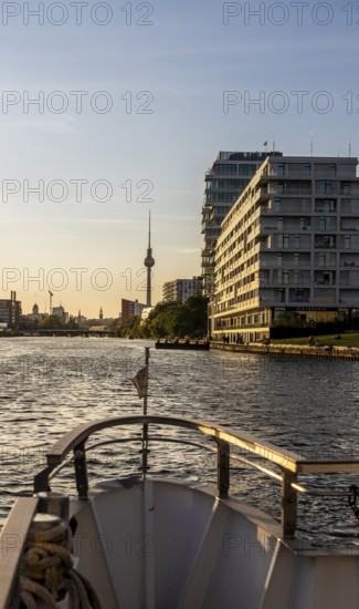 View from the Spree to an apartment building at the East Side Galery and the TV tower on the