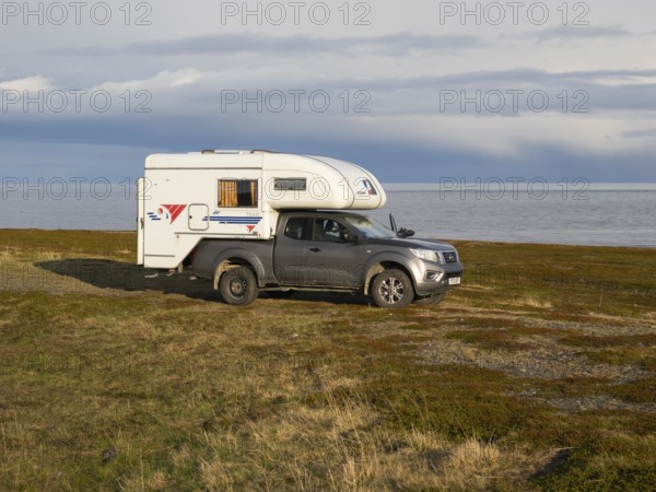 Mobile Camper parked near the Arctic Ocean shore, May, Varanger Fjord, Norway, Europe