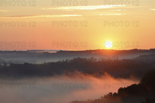 Sunrise, fog rising over the Arnsberg Forest nature park Park, North Rhine-Westphalia, Germany,