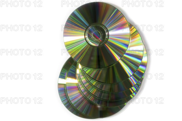 A pile of glittering CDs stacked on top of each other, white background