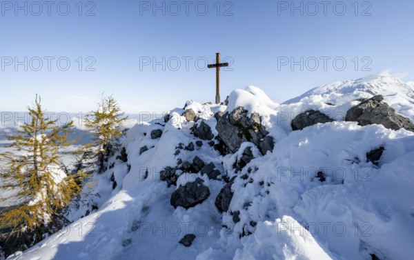 Snow-covered summit of the Jenner with summit cross in autumn, Berchtesgaden National Park,