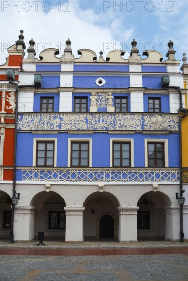 Magnificent Renaissance building with blue façade and ornate decorations under arcades, Great