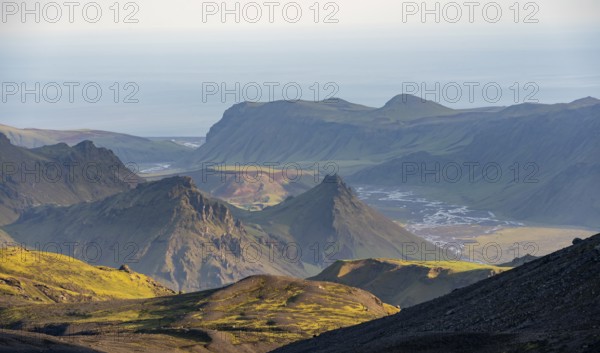 Volcanic mountain landscape overgrown with moss, atmospheric mountain landscape in the evening