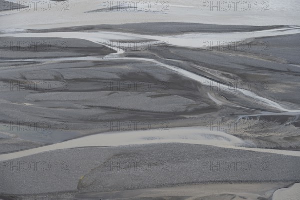 Detail, structure, river course in a gravel bed with black sand, meandering river, Dímonarhellir,