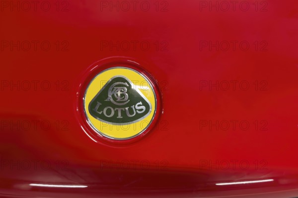 Close-up of logo of car brand sports car manufacturer Lotus from 2010 to, 2019 on red bonnet bonnet