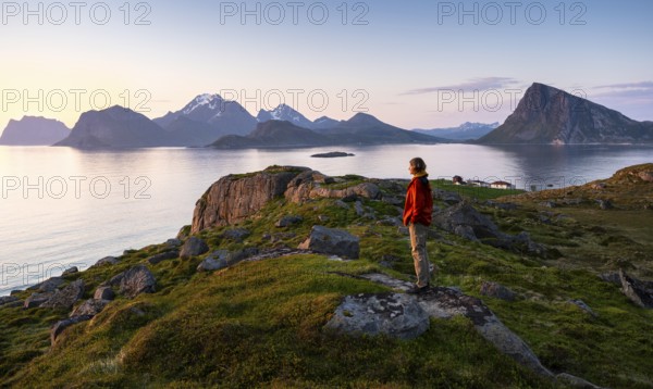 Landscape at Stornappstinden mountain. A hiker looks out over the landscape. View of the mountains