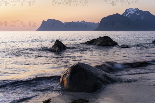 Seascape. On the beach at Myrland. Rocks and sea, with Mount Hogskolmen in the background on the