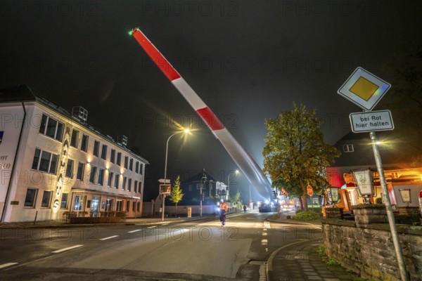 Transport of a 68 metre long, 22 tonne blade of a wind turbine, here in Breckerfeld, with a