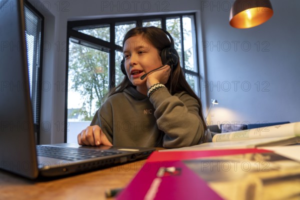 Homeschooling, girl, 11 years old, learns at home, home learning, lessons at home, distance