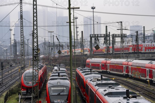 Railway tracks with regional trains, after freezing rain, in front of Frankfurt main station,