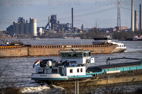 The Rhine near Duisburg, cargo ships, backdrop of the ThyssenKrupp Steel steelworks in Duisburg