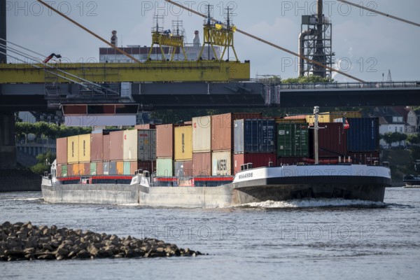 Inland navigation on the Rhine near Duisburg, container ship Hollande, fully loaded, Rhine bridge