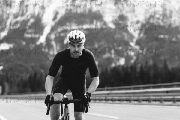 Road bike rider in spring between Lechtal and Tannheimer Tal in front of picturesque scenery of the