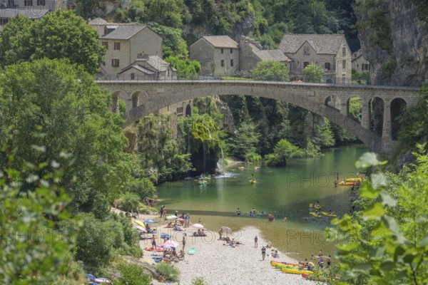 View of the village of Saint Chely with bridge and waterfall, Gorges du Tarn Causses, Département
