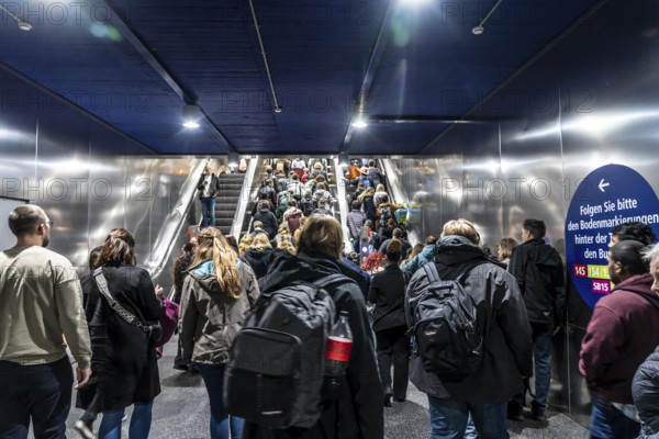 Public transport, underground, main station exit, many people crowding out of the underground
