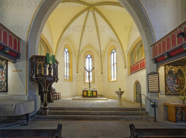 Pulpit, altar, crucifix and baptismal font, late Gothic Protestant-Lutheran town church of St