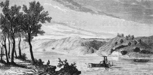 Mountainous natural landscape in the state of Missouri with steamboat on the Mississippi River,