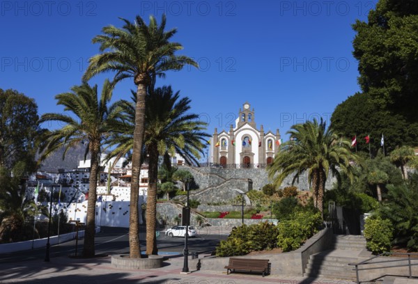 Village square with palm trees and church in Santa Lucía de Tirajana, Gran Canaria, Canary Islands,