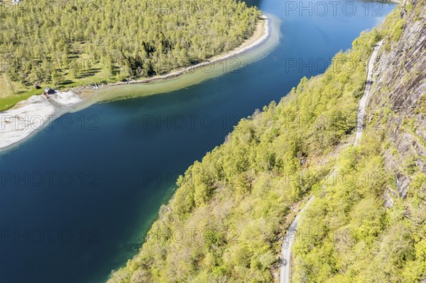 Aerial view of lake Lovatnet (or: Loenvatnet), gravel mountain road above the lake, valley Lodalen