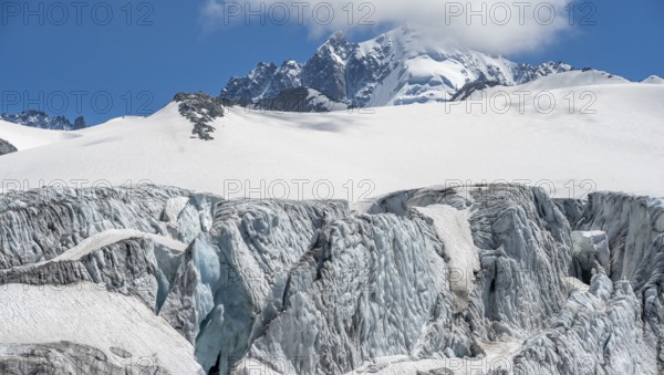 High alpine mountain landscape, Glacier du Tour, glacier with crevasses and mountain peak, summit