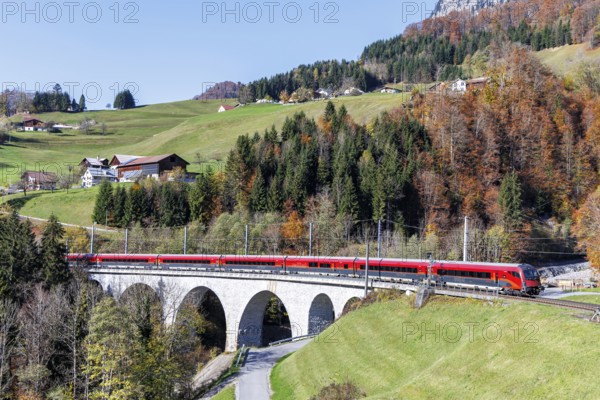 Railjet railway passenger train of the Austrian Federal Railways ÖBB on the Arlbergbahn in autumn