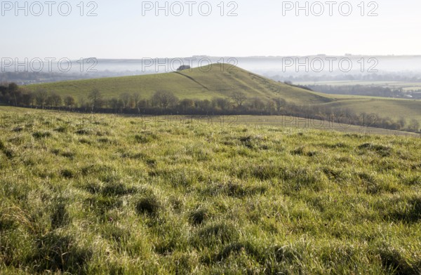 Picked Hill chalk outlier landscape misty valley floor, Vale of Pewsey, from Woodborough Hill,