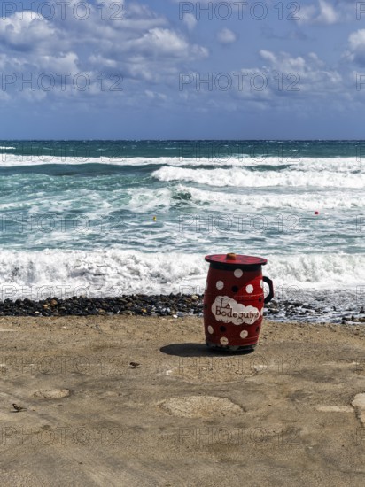 Red outdoor bar table, jug, bar with sea view, beach bar, Cabo de Gata Natural Park,